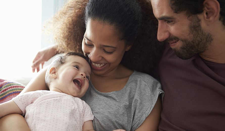 Happy couple with a baby.