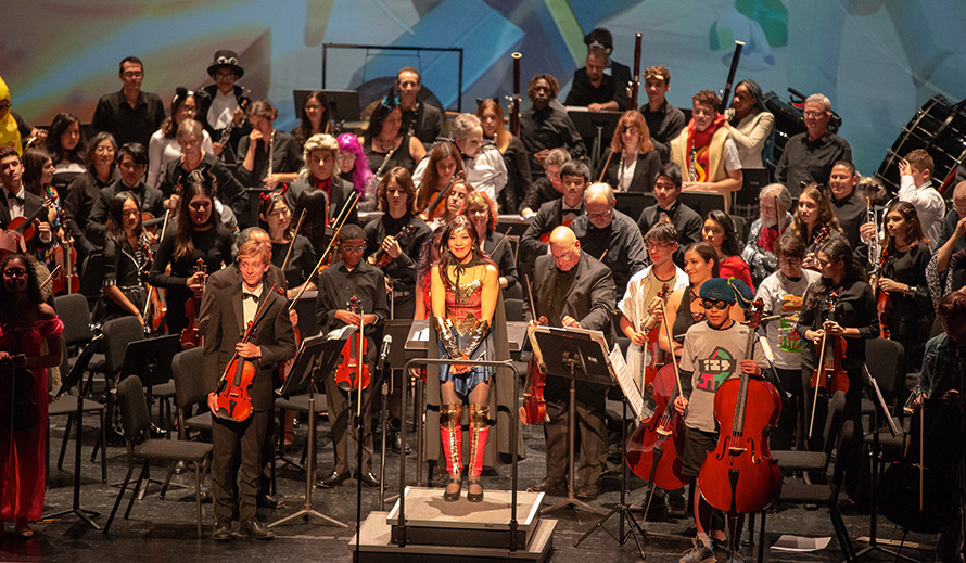 Wonderwoman, aka Maestra Huifang Chen, conducts the Greater Miami Youth Symphony.