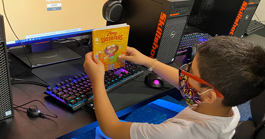 A child competes in the 2020 Battle of the Books online. 