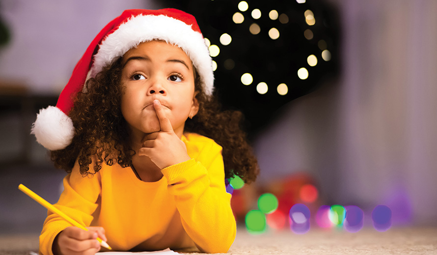 A young girl thinks about what to write during the holidays. 