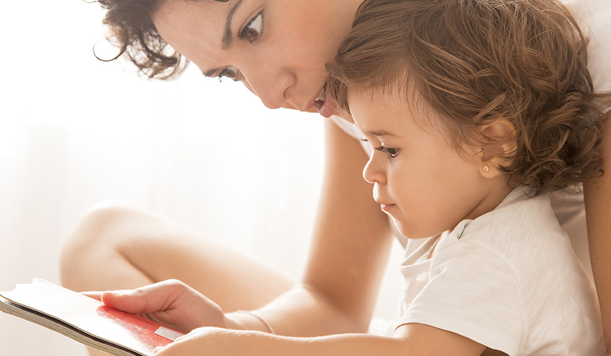 Mother reading to her child.