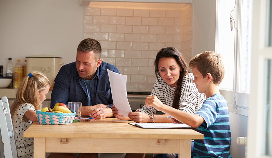 Family discussion at the kitchen table