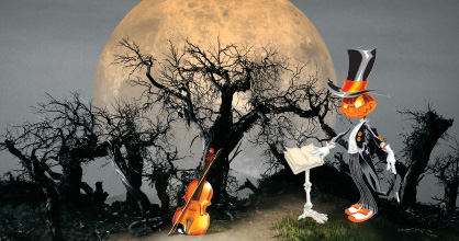 Image of pumpkin conductor in dreary forest at night with the full moon rising in the background