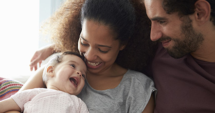 Happy couple with a baby.