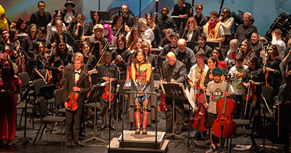 Wonderwoman, aka Maestra Huifang Chen, conducts the Greater Miami Youth Symphony.